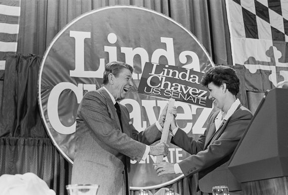 President Reagan gleefully accepts a campaign placard from Maryland Republican Senate candidate Linda Chavez (Credit: Bettmann/Getty Images) democracy_chavezreagan.jpg
