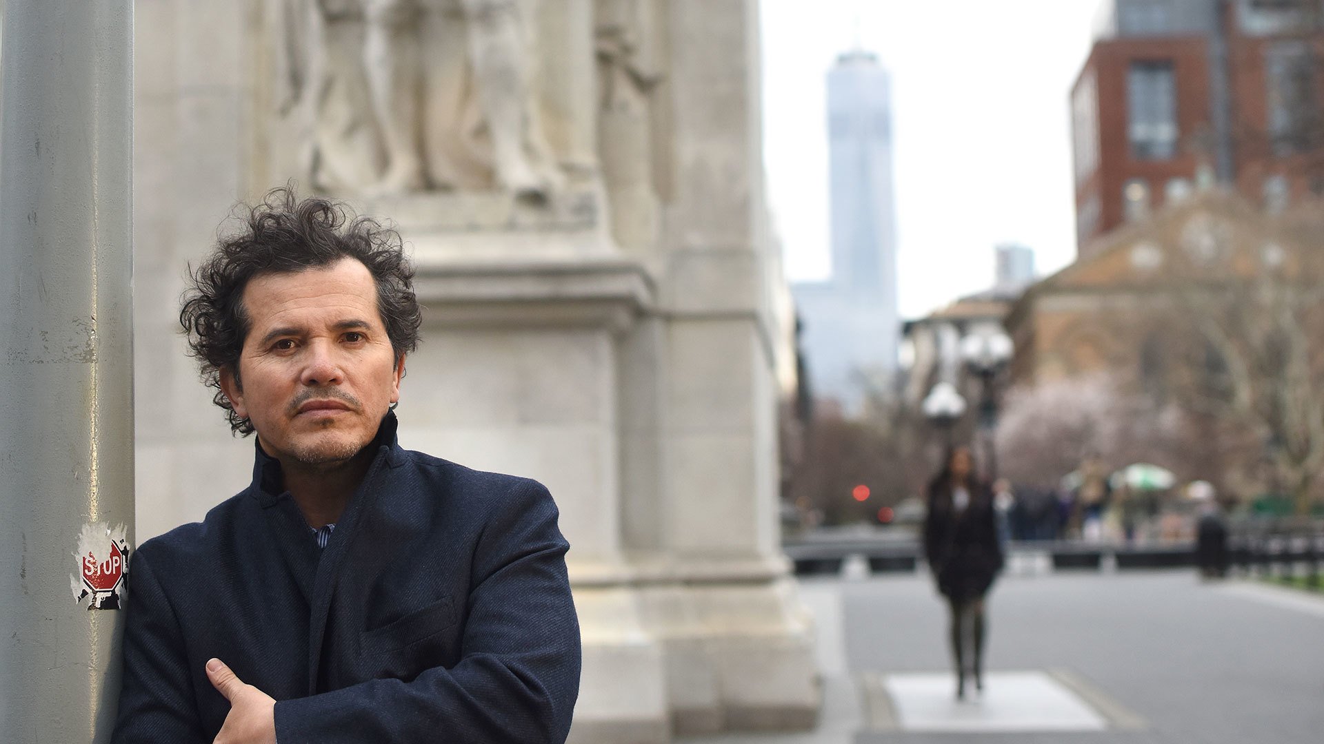 John Leguizamo on the sidewalk
