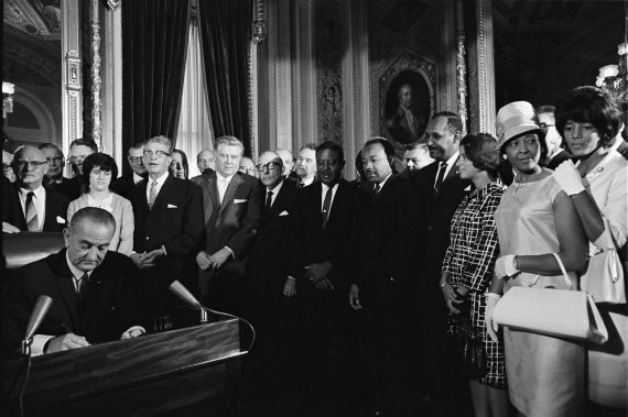 President Lyndon Johnson signs the Voting Rights Act in 1965 democracy_LBJ_votingrightsact.jpg